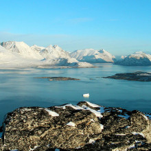 Scenery from Ravnefjeldet, Nanortalik (Southernmost part of Greenland) on a clear December morning. The jagged mountains in background (left) are the 1300m high 'Savtakkerne'.