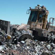 Rubbish dump bulldozer rubbish compactor