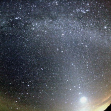 Orionid meteor striking the sky below Milky Way and to the right of Venus. Zodiacal light is also seen at the image. The trail of the meteor appears slightly curved due to edge distortion in the lens.