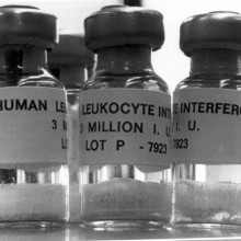 Three vials filled with human leukocyte interferon.