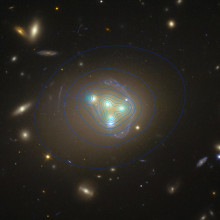 The galaxy cluster Abell 3827. The distribution of dark matter is shown with blue lines.