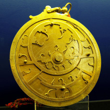  An 18th Century Persian astrolabe - maker unknown. The points of the curved spikes on the front ''rete'' plate, mark the positions of the brightest stars. The name of each star being labeled at the base of each spike. The back plate, or ''mater'' is...