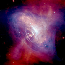  A composite image of the Crab Nebula showing the X-ray (blue), and optical (red) images superimposed. The size of the X-ray image is smaller because the higher energy X-ray emitting electrons radiate away their energy more quickly than the lower...