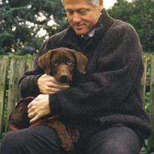 Persident Bill Clinton getting acquainted with Buddy on the South Lawn, December 5, 1997.