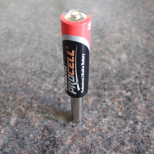 Battery and magnet