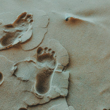 Footprints in sand on the beach