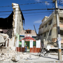 A man exits a restaurant after he looked for his belongings. An earthquake rocked Port au Prince on January 12, 2010.