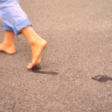 Healthy feet of an 11-year-old girl who regularly goes barefoot. Note the presence of ideal arches, looking at her footprints on the dirty floor.