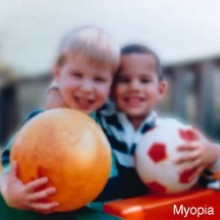Human eyesight - two children and ball with myopia short-sightedness