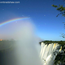 Photo of a Lunar Rainbow taken from the Zambia side of Victoria Falls. The constellation Orion is visible behind the top of the moonbow.