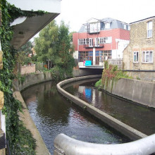 River Wandle, Strathville Rd, SW18 River Wandle, Strathville Rd, SW18. From a road bridge, with some new flats built over the river.