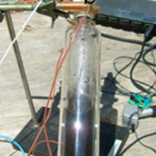  Photograph of system used in the temperature evolution of solar steam generation: (a) transparent vessel isolated with a vacuum jacket to reduce thermal losses, (b) two thermocouples for sensing the solution and the steam temperature, (c) pressure...