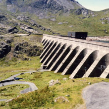 The upper reservoir (Llyn Stwlan) and dam of the Ffestiniog Pumped Storage Scheme in north Wales. The four water turbines at the power station can generate 360 MW of electricity within 60 seconds of the need arising.