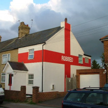 We wuz robbed. I understand that this house was painted this way after England lost to Portugal 6-5 on penalties in Euro 2004, in controversial circumstances.