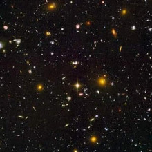 Figure 4: Hubble Ultra Deep Field. Recently, astronomers using the Hubble unveiled the deepest look into the universe yet, showing what could be the most distant and the youngest galaxies ever seen.