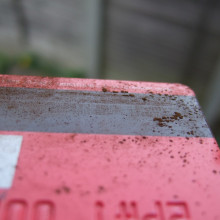 Fine particles of rust show up the magnetic lines on a credit card