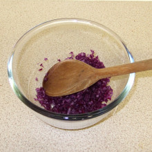 Crushing the red cabbage with a little water