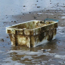 A plastic box washed up on a beach