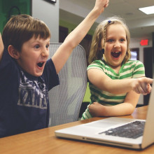 Two children happily playing games.