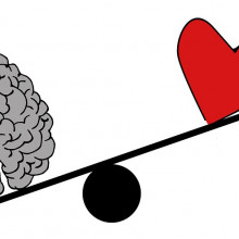 A cartoon brain outweighing a cartoon heart on a balance scale.