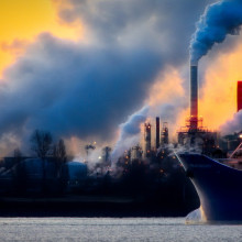Smoke emissions and air pollution from an industrial landscape.