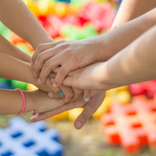 Children hands on top of each other