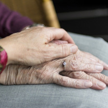 The hands of an elderly couple.