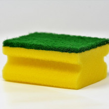 A green and yellow dish sponge