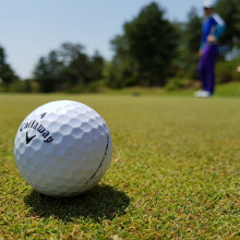 A golf ball on a green.