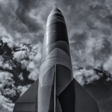 a greyscale image of a large rocket