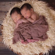 Two twin babies sleeping.