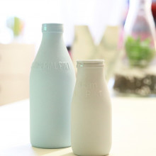 Two dairy bottles. Two dairy bottles.