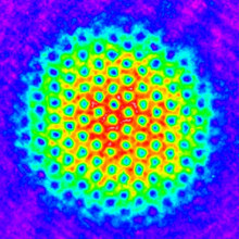 A colorized lattice of tornado-like vortices within a spinning Bose Einstein condensate of rubidium atoms. 