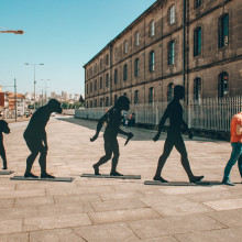 Evolution of humans with man holding smart phone at end of line