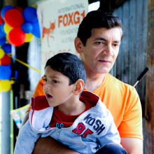 Kushagra Singha, a child with FOXG1 Syndrome, with his father Vivek.