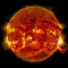 NASA's Solar Dynamics Observatory captured this image of a solar flare on Oct. 2, 2014. The solar flare is the bright flash of light on the right limb of the sun. A burst of solar material erupting out into space can be seen just below it.