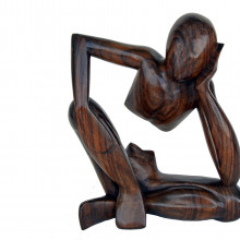 Wooden carving of a person thinking
