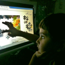 Child using touch screen device