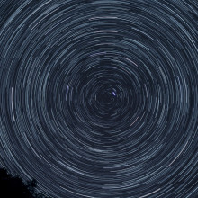 Star trails photographed at night with a long exposure