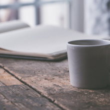 White mug on wooden table White mug on wooden table