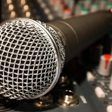 A microphone and mixing desk