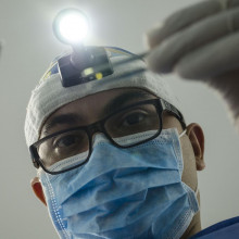 A dentist examining a patient's mouth