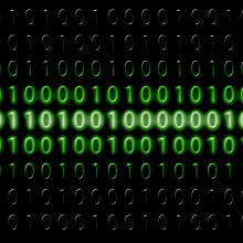 Binary digits on a green computer display.