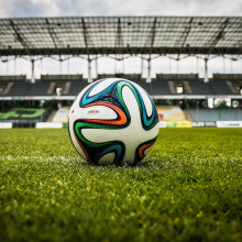 A football in an empty stadium.