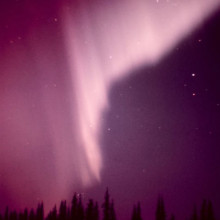 Aurora borealis in the vicinity of Anchorage, Alaska. Example of a curtain-like aurora.
