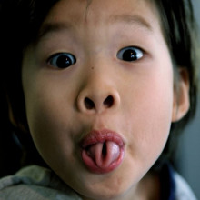 A child rolling her tongue