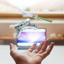 Medical apparatus floating above an outstretched hand.