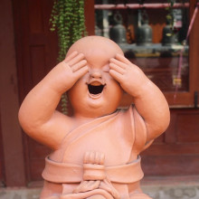 Laughing meditation statue