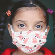 A child in a Covid mask