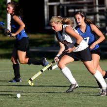 Girls playing hockey